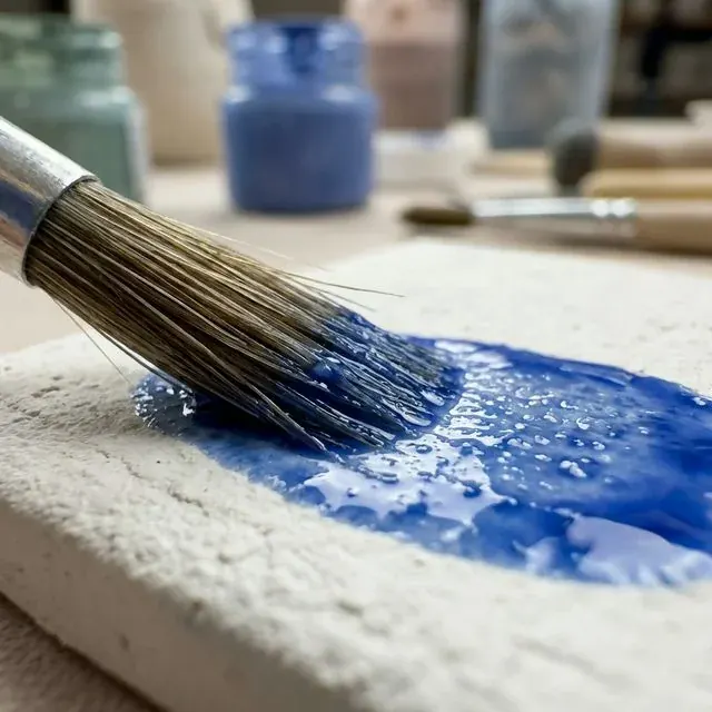 Hand-painting cobalt glaze on Azulejo ceramic tile in Goa